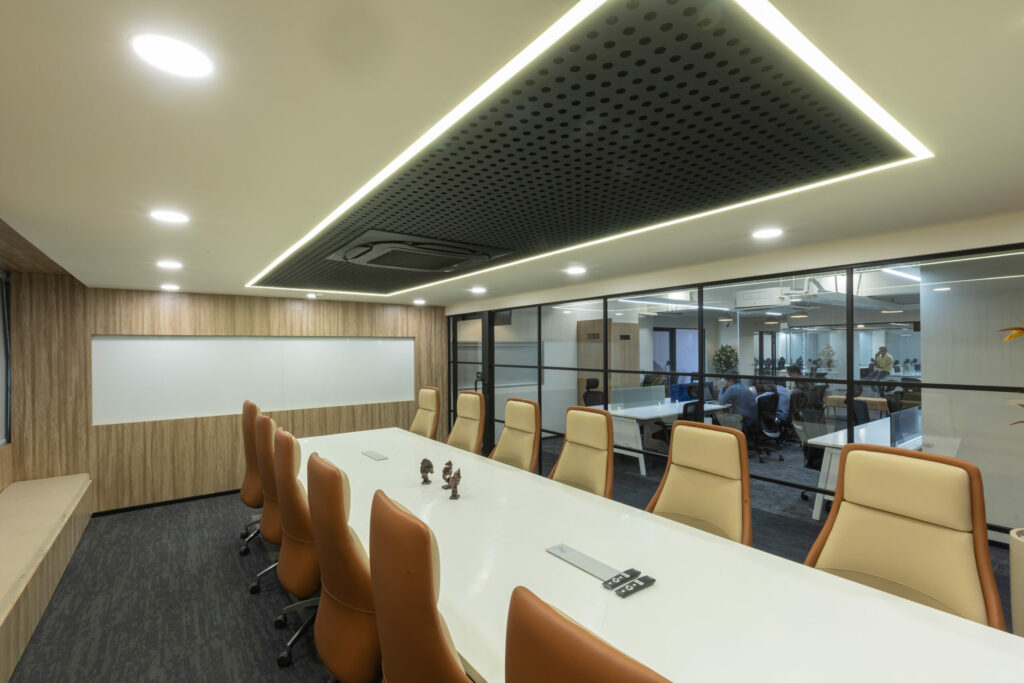 This picture, which features a beautifully created workspace, shows off the extraordinary talent of professional office interior designers in Hyderabad. With a seamless fusion of aesthetics and functions, the office emits a sense of contemporary sophistication and efficiency. The design mixes a relaxing color pattern of neutrals with accents of vivid color to promote a productive atmosphere.