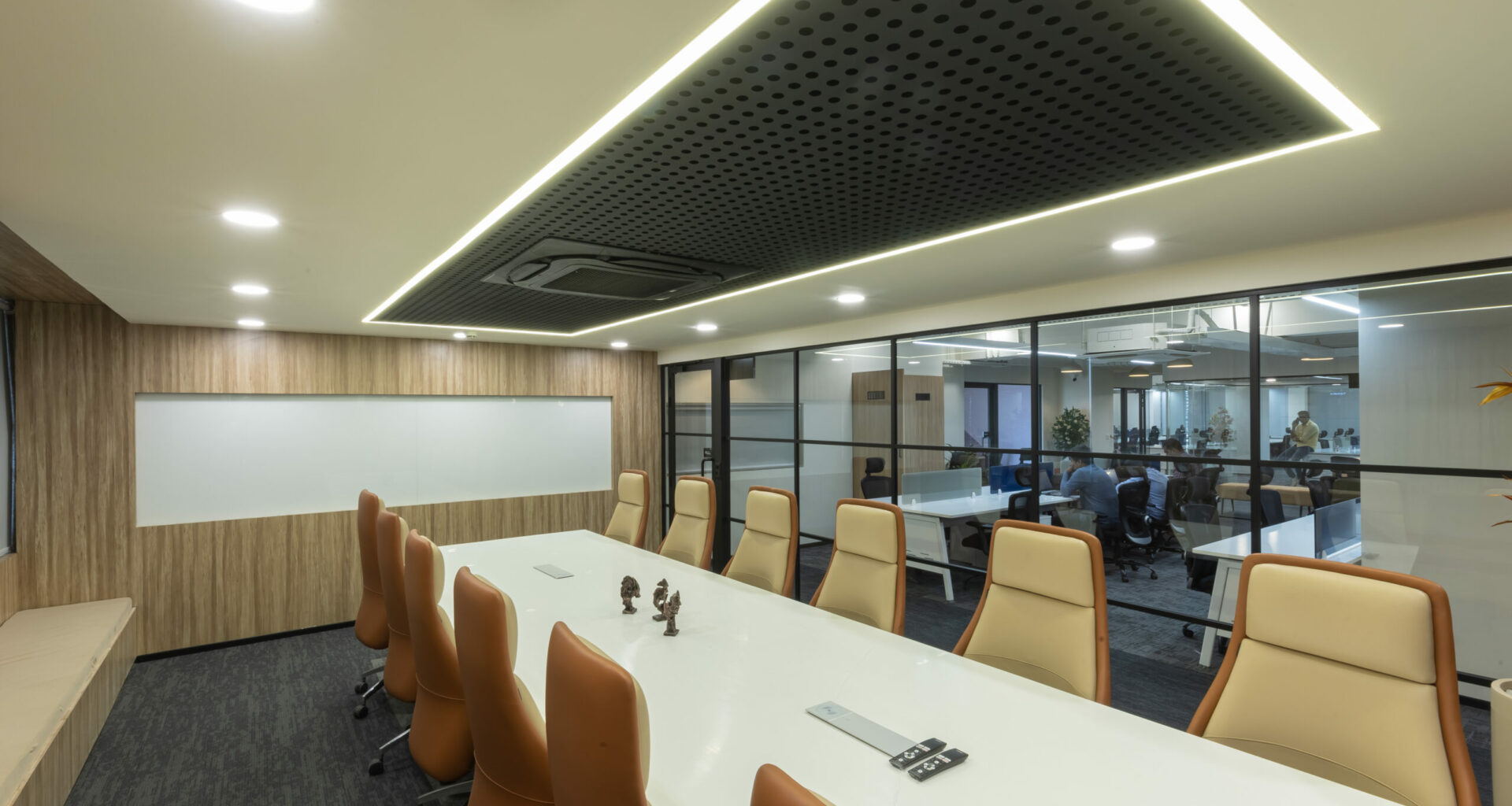 This picture, which features a beautifully created workspace, shows off the extraordinary talent of professional office interior designers in Hyderabad. With a seamless fusion of aesthetics and functions, the office emits a sense of contemporary sophistication and efficiency. The design mixes a relaxing color pattern of neutrals with accents of vivid color to promote a productive atmosphere.